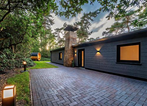 Hotelli välisilme, Ferienhaus Waldblick mit Whirlpool und Sauna in Hellwege