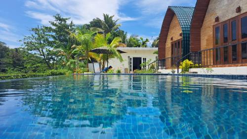 Swimming pool, Maggona Boutique Cottages in Beruwala