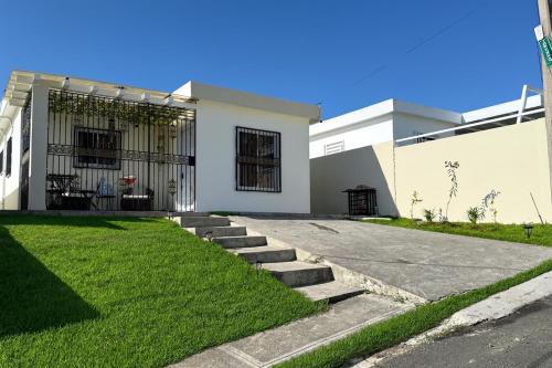 Exterior view, Our Cozy Home, Wi-Fi, AC, Parking, Near Beaches and Attractions in quiet area in Nagua