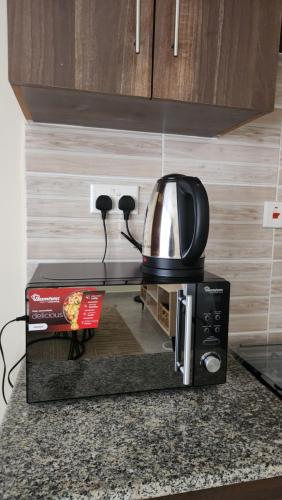 virtuve, Elegant Homestay Milimani in Kisumu