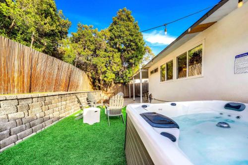 Spacious 4BR Retreat with Hot Tub Fire Pit and Patio in Mid-City