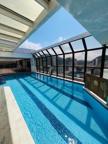 Guarujá Golden Beach 158 - Conforto com Piscina Climatizada – khách sạn tại Pitangueiras