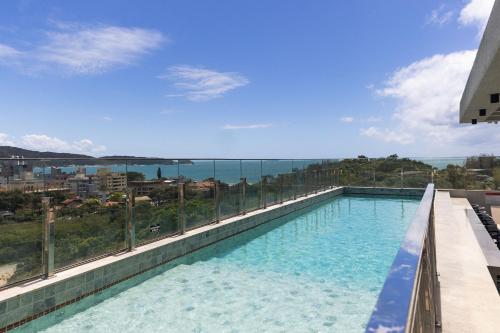 Loft confortável em condominio com Piscina – khách sạn tại Bombas