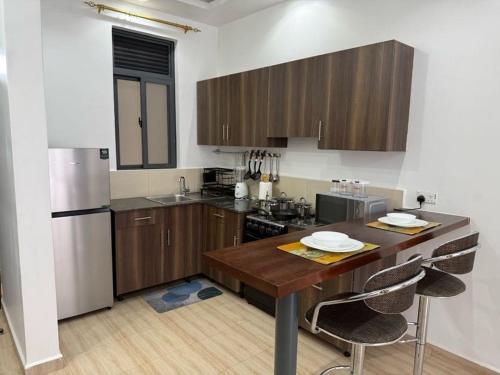 keuken, Bright & Modern 1-Bedroom Apartment at Pearl Marina in Lyamutundwe
