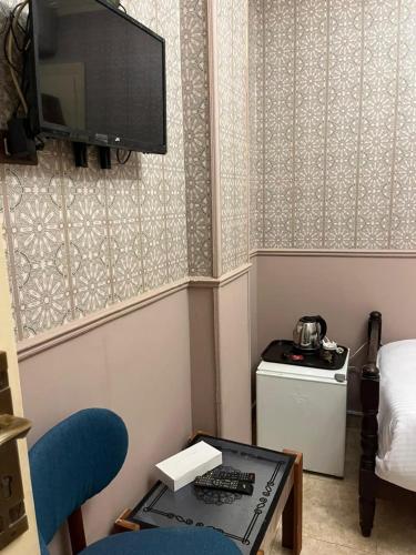 Chambre triple, vue sur la ville, 3 lits