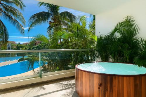 High-End Waterfront Condo at Secrets Waters, Puerto Aventuras