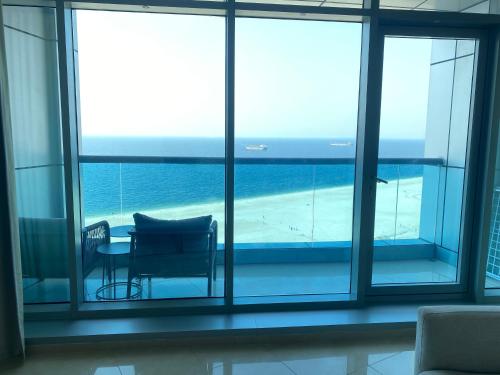 2BR Beachfront Apartment with Ocean Views, Ajman