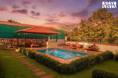 Exterior view of StayVista's Rustique Radiance - Hillside Retreat with Outdoor Pool & South Indian Architecture