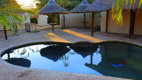 Swimming pool, Waterfall Guesthouse in Rustenburg