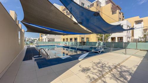 Swimming pool, Escape 24 Spacious 1BR in Al Khail Heights in Al Quoz