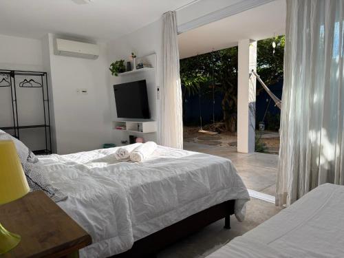 เตียงนอน, Charmosa hospedagem no Jardim Secreto SP in ริโอเปเกโน