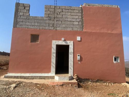 house surrounded by trees in a village in Mirhleft