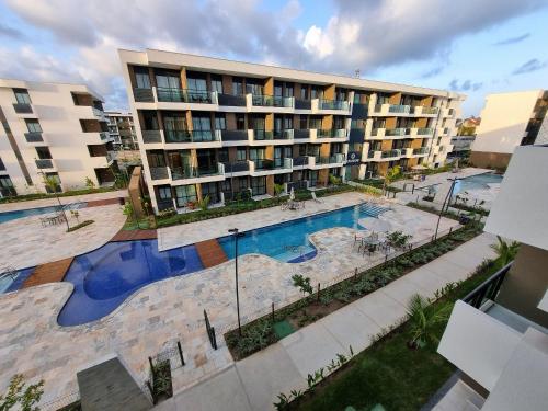 수영장, Seu refúgio perto do mar em Muro Alto | Makia B324 - By Anfitrião Legal (Seu refugio perto do mar em Muro Alto | Makia B324 - By Anfitriao Legal) in 무루 알투 비치