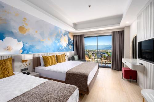 Koplietošanas atpūtas telpa ar TV, Arsuz Jumanah Premium Hotel in Ulucinar