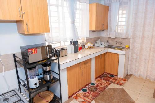廚房, Pearl Furnished Apartment Skyview Hideaway in 涅里