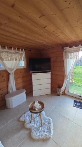 Koplietošanas atpūtas telpa ar TV, Appartement 1 chambre in Longevilles-Mont-d'Or
