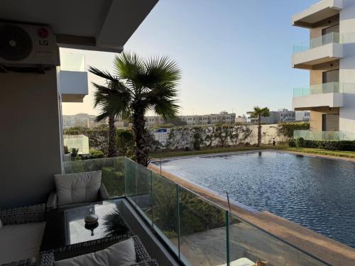 Swimming pool, Superbe appartement 120 mc, Plage a pieds, 3 piscines & calme garanti - Sidi Rahal Plage in Sidi Rahal