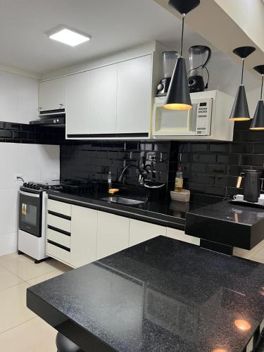 Kitchen, Praia Pitangueiras Guaruja Apto 74 Pe na Areia e Vista para o Mar near Rasa Manjari
