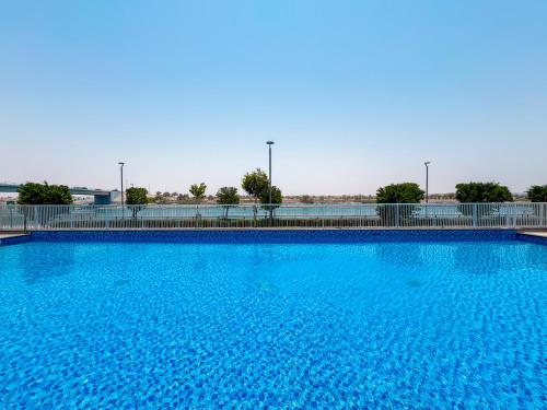 Swimming pool, One Bedroom Apartment by Otolo Homes with Free Yas Theme Park Tickets in Al Raha Beach