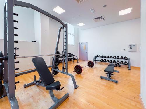 Fitness center, One Bedroom Apartment by Otolo Homes with Free Yas Theme Park Tickets in Al Raha Beach