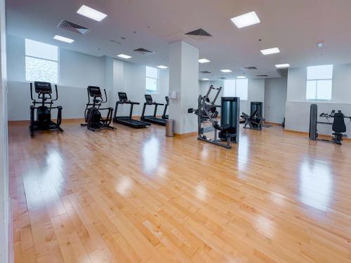 Fitness center, One Bedroom Apartment by Otolo Homes with Free Yas Theme Park Tickets in Al Raha Beach
