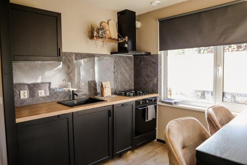 virtuve, Sfeervol vakantiehuis met sauna omgeving Breda - VP100 in Hoeven (North-Brabant)