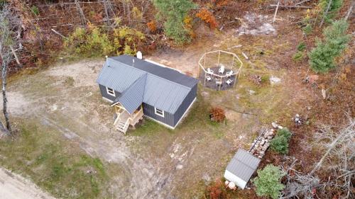 Secluded Rustic Cabin with Hot Tub Near Pere Marquette River in Big Rapids, Michigan in Luther (MI)