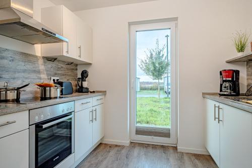 Cocina, Schleivilla Lootsen Hus by Seeblick Ferien ORO, 3Etagen,8Pers,Sauna,Kamin in Olpenitz