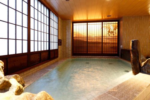Hot spring bath, Dormy Inn Nagano Zenkounoyu Natural Hot Spring near Mizuno Museum