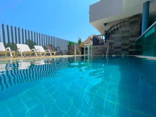 Swimming pool, Escapada Perfecta en Apartasuites Privadas Covenas in Covenas