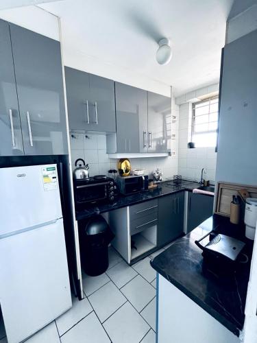 Kitchen, Home away from Home in Marine Parade