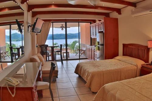 Oceanview Studio Apartment with Community Pool & Views of Flamingo Marina in Playa Flamingo
