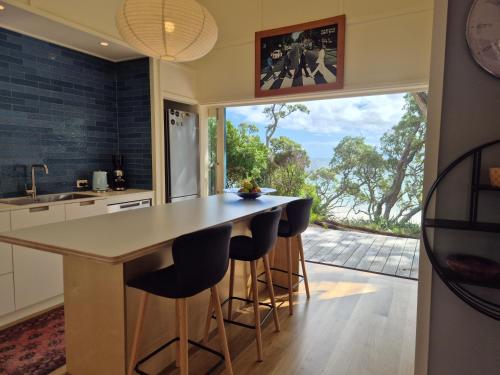 Seaside Serenity - Prime Beachfront Position in Great Barrier Island