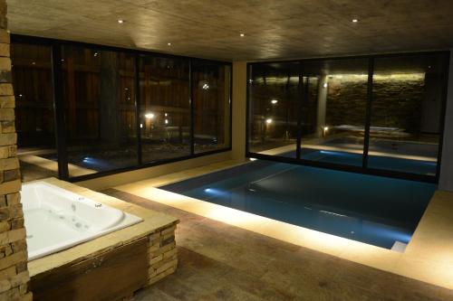 Swimming pool, El Oasis Apart Hotel in San Martin De Los Andes
