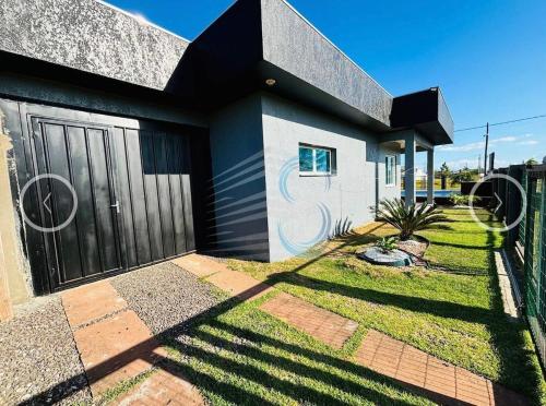 Casa de praia com piscina in Arroio do Sal