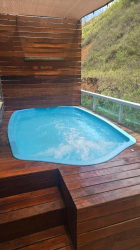 Apartamento com vista para piscina com hidromassagem e aquecedor in Cataguases