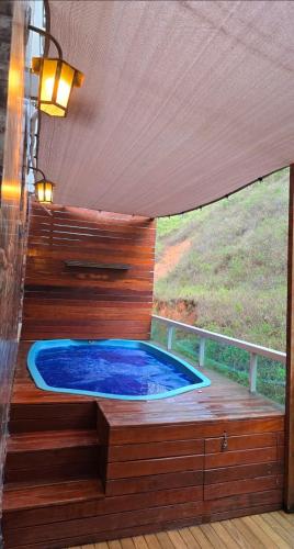 Apartamento com vista para piscina com hidromassagem e aquecedor in Cataguases