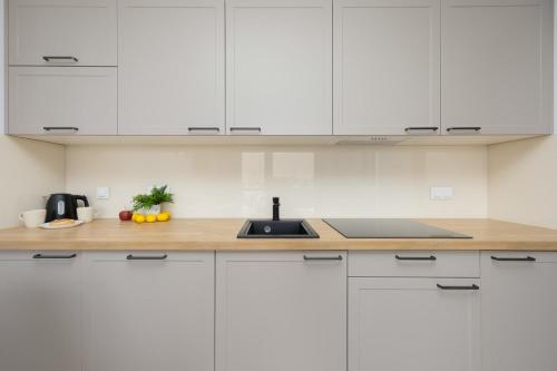 Ursynów Apartment with Desk & Balcony by Noclegi Renters - image 4