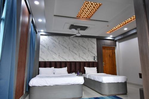 Asha Banquet And Hotels