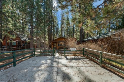 Romantic Getaway - Cozy and beautifully wooded getaway cabin with Hot Tub and a Fenced Yard! in Big Bear City, USA