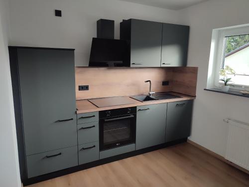 Kitchen, Ferienhaus Franzi mit Grill, Garten und Terrasse in Grebenhain