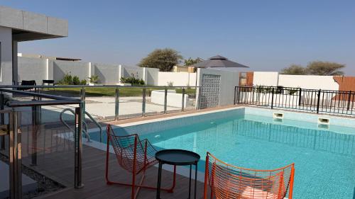 Swimming pool, concrete villa in Al Wasil