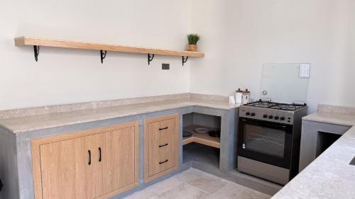 Kitchen, concrete villa in Al Wasil