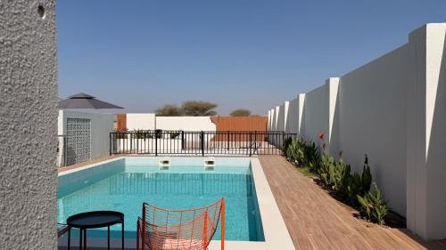 Swimming pool, concrete villa in Al Wasil