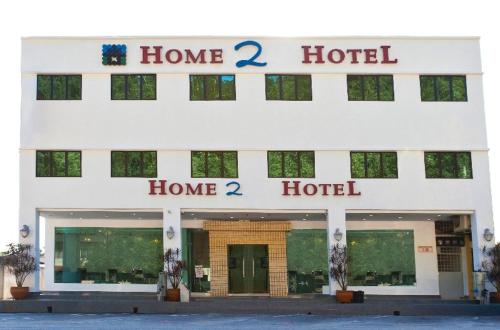 a large building with a sign on the side of it, Home 2 Hotel in Chukai