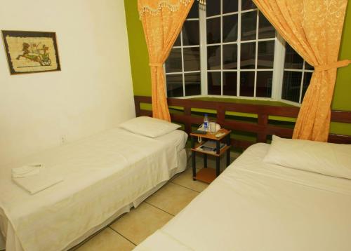 Hotel Tazumal House The 2-star Hotel Tazumal House offers comfort and convenience whether youre on business or holiday in San Salvador. The property features a wide range of facilities to make your stay a pleasant exper