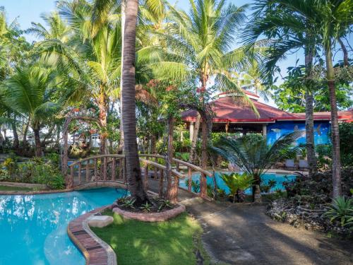 Swimming pool, Polaris Beach and Dive Resort Inc in Loon