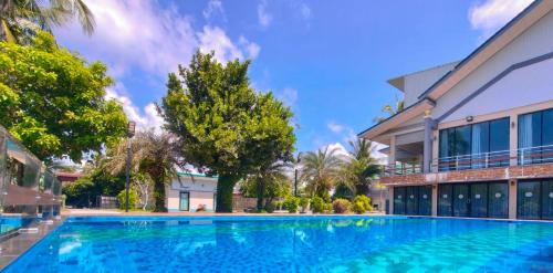 Swimming pool, The Coco Grand Chalet Pakbara in Satun