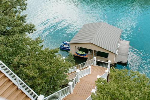 View, Waterfront Retreat with Dock, Pool and Jet Skis in La Follette
