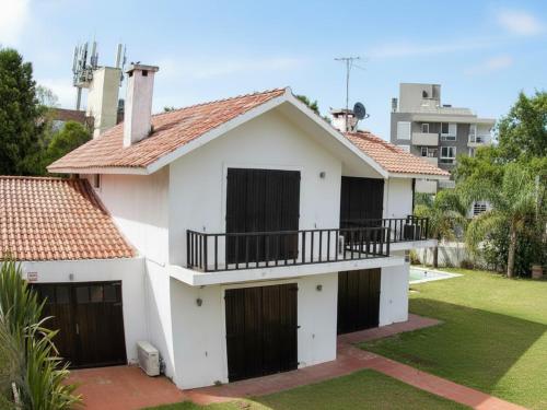House steps from Playa Mansa with pool